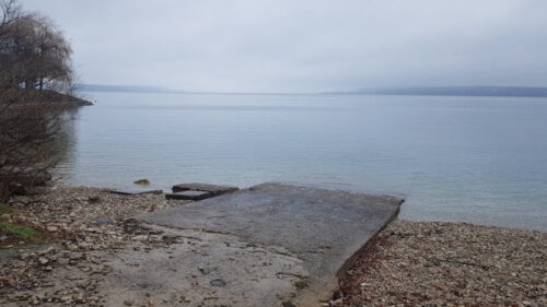 photo of shoreline with ramp into the body of water